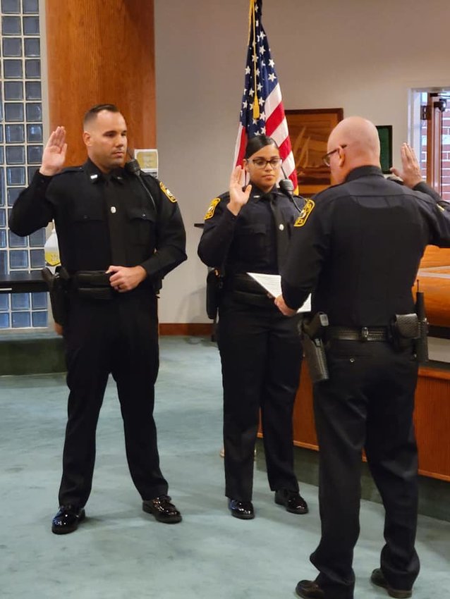Apopka Police Chief swears in APD Officers David Hurst II and Asia Grajales.